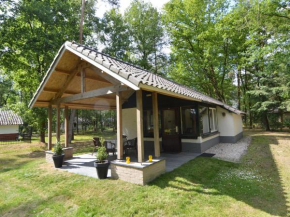 Отель Detached bungalow with lovely covered terrace in a nature rich holiday park  Stramproy